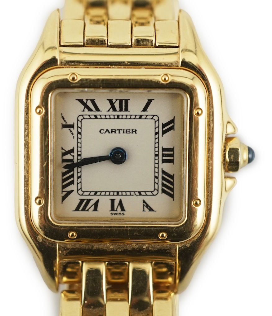A lady's 18ct gold Cartier Panthere quartz wrist watch